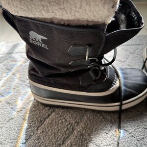 Sorel Caribou Black and White Lace-Up Winter Boot with Shearling Cuff